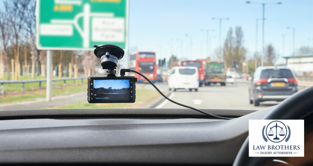 A car with a dashcam mounted on the windshield